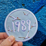 Eras pin (1.3 × 2.9 inch) and 1989 patch (3.15 inch)